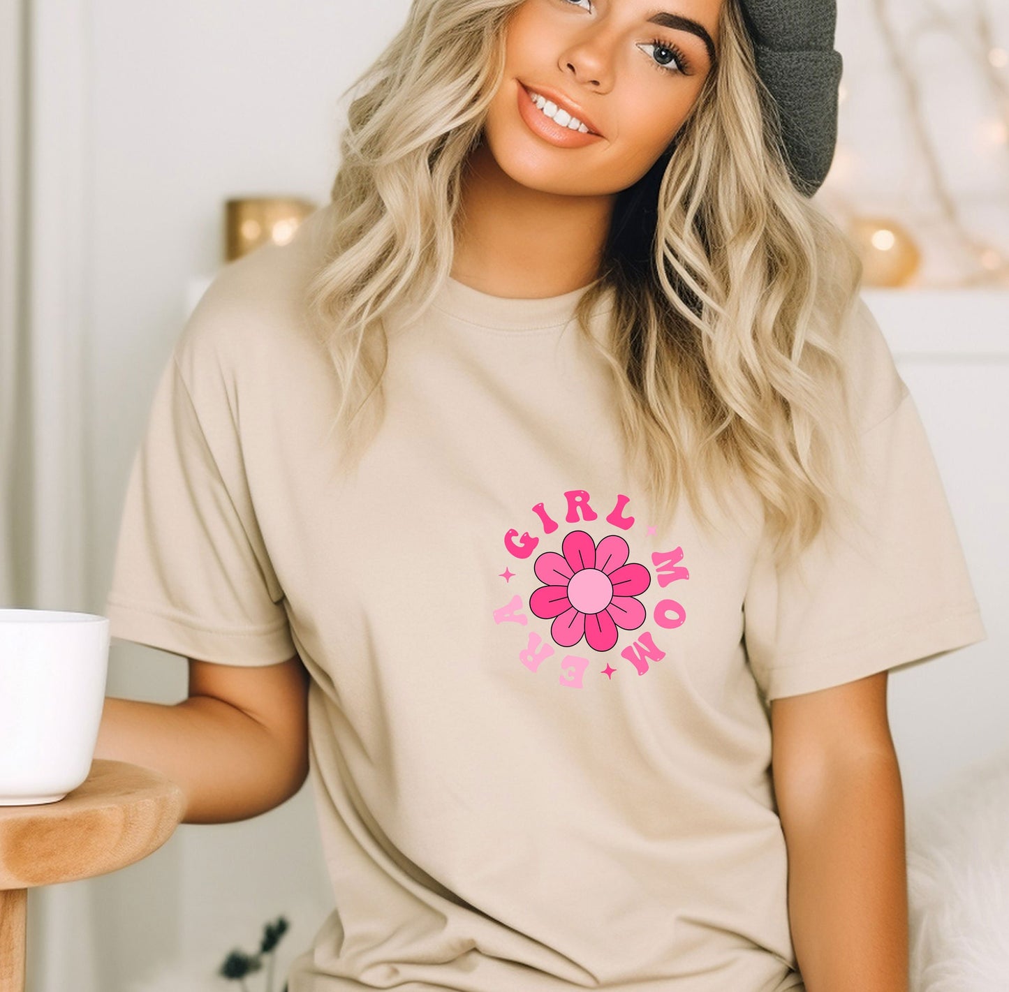 a woman wearing a t - shirt with a flower on it