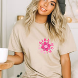 a woman wearing a t - shirt with a flower on it