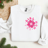 a white sweatshirt with a pink flower on it