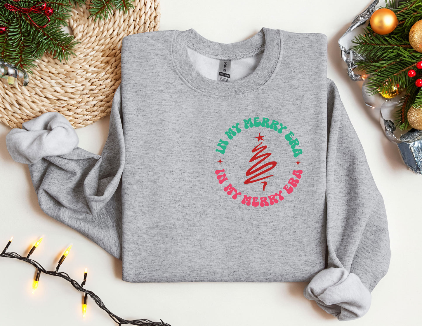 a gray sweatshirt with a christmas tree on it