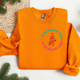 an orange sweatshirt with a green and pink design on it