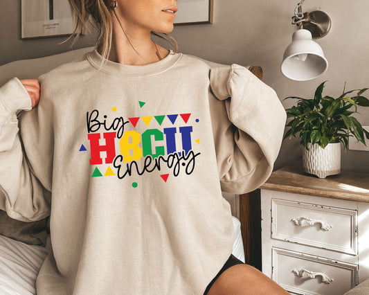 a woman wearing a sweatshirt that says big bright energy