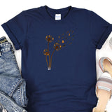 a blue t - shirt with a bunch of flowers on it