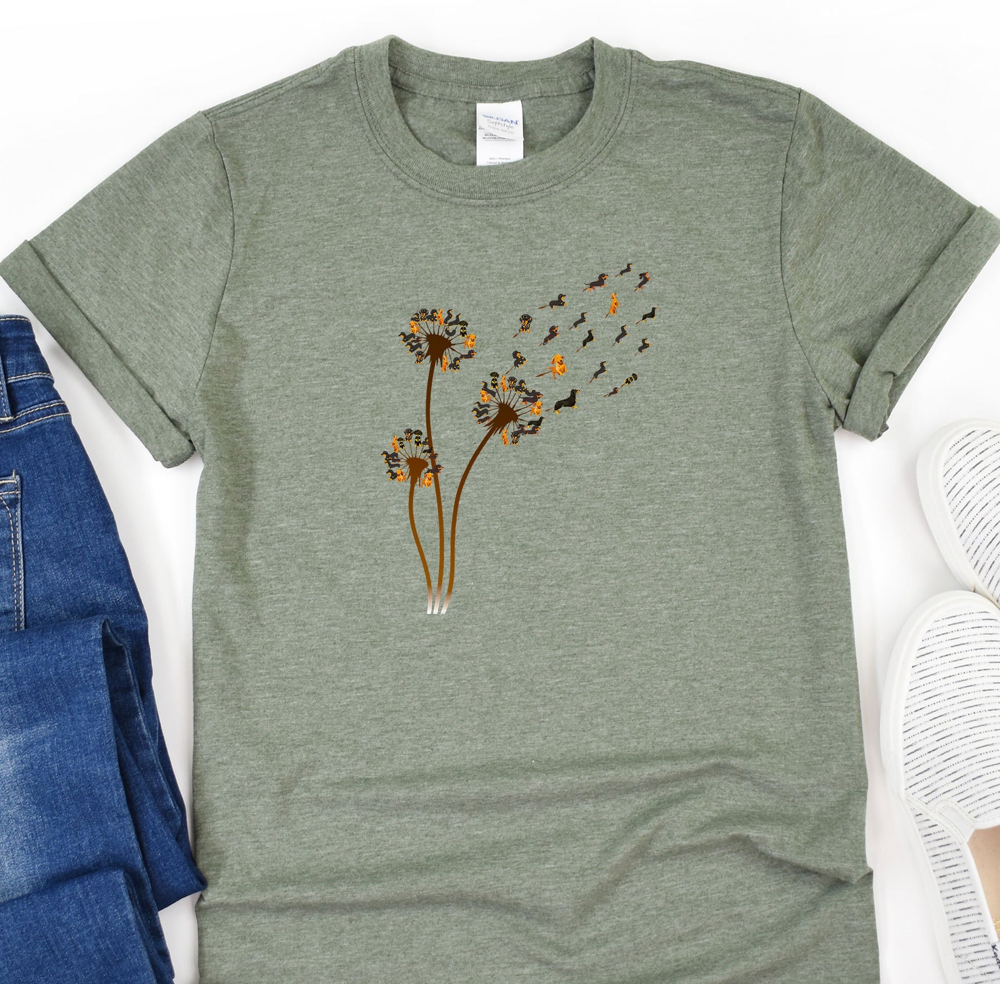 a t - shirt with a dandelion design on it