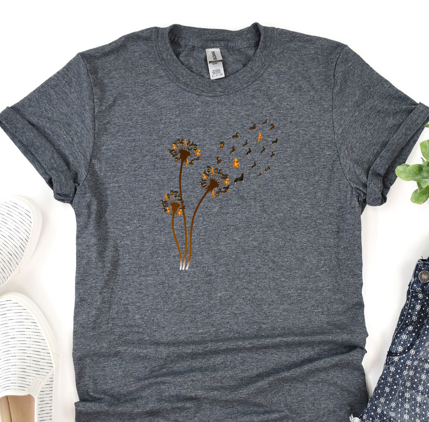 a t - shirt with a dandelion design on it