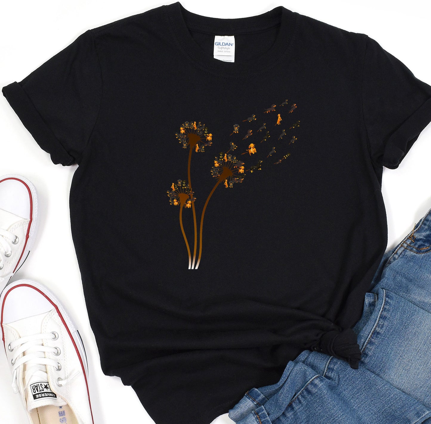 a t - shirt with a dandelion design on it