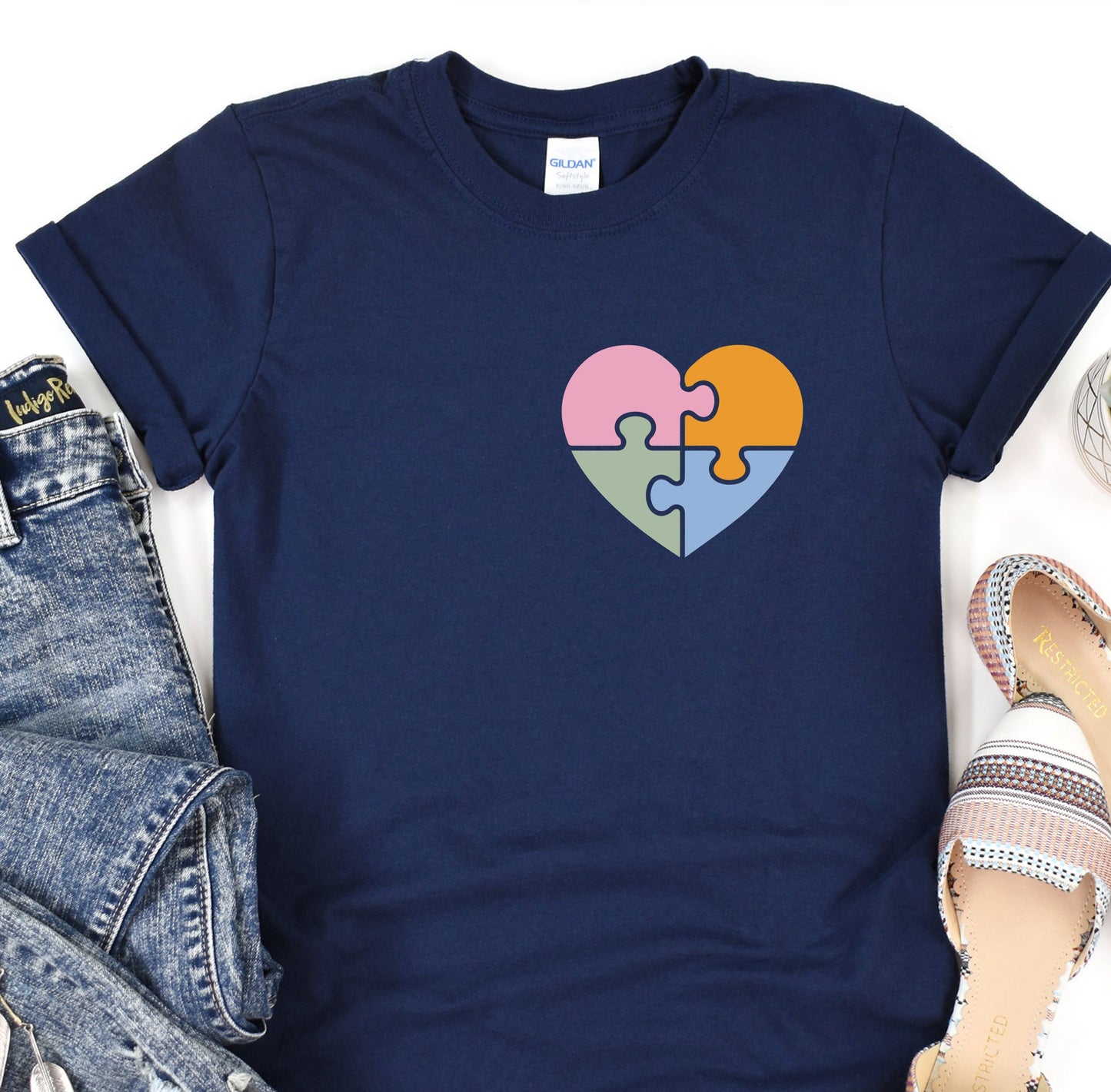 a t - shirt with a puzzle heart on it