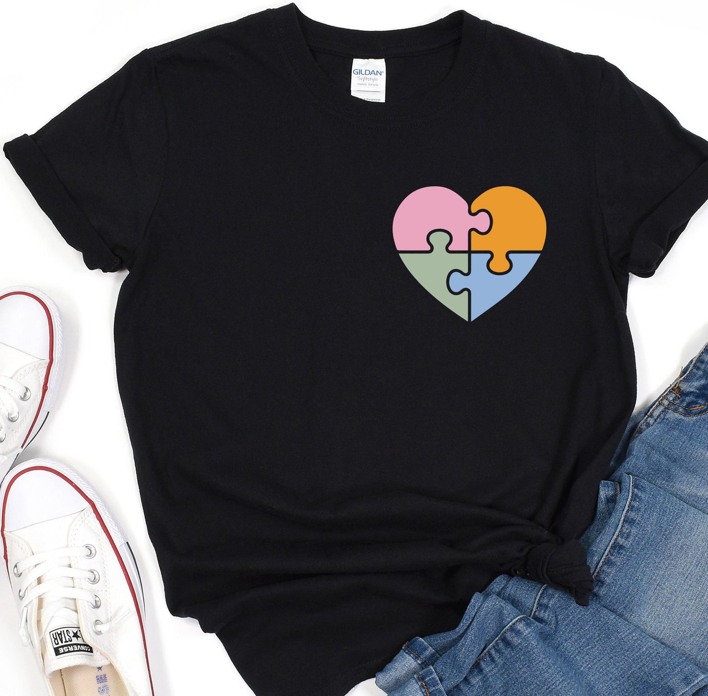 a t - shirt with a puzzle heart on it