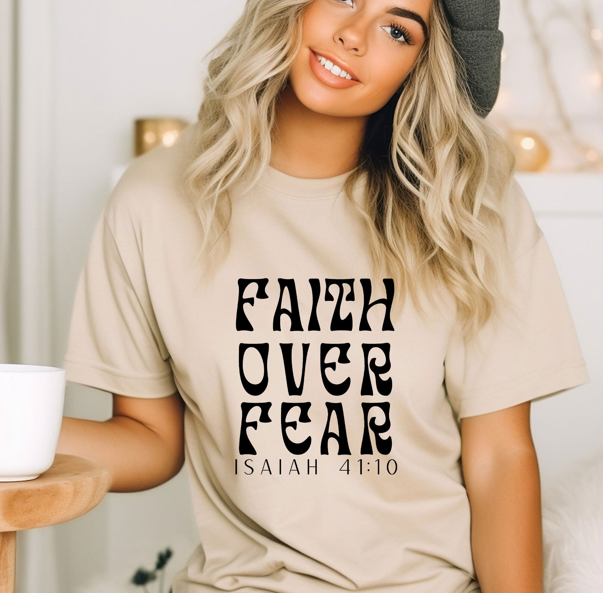 a woman wearing a t - shirt that says faith over fear