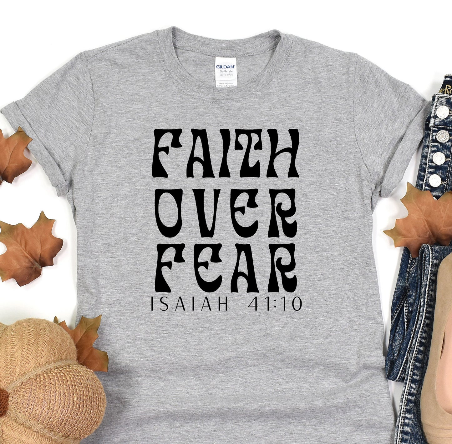 a t - shirt with the words faith over fear printed on it