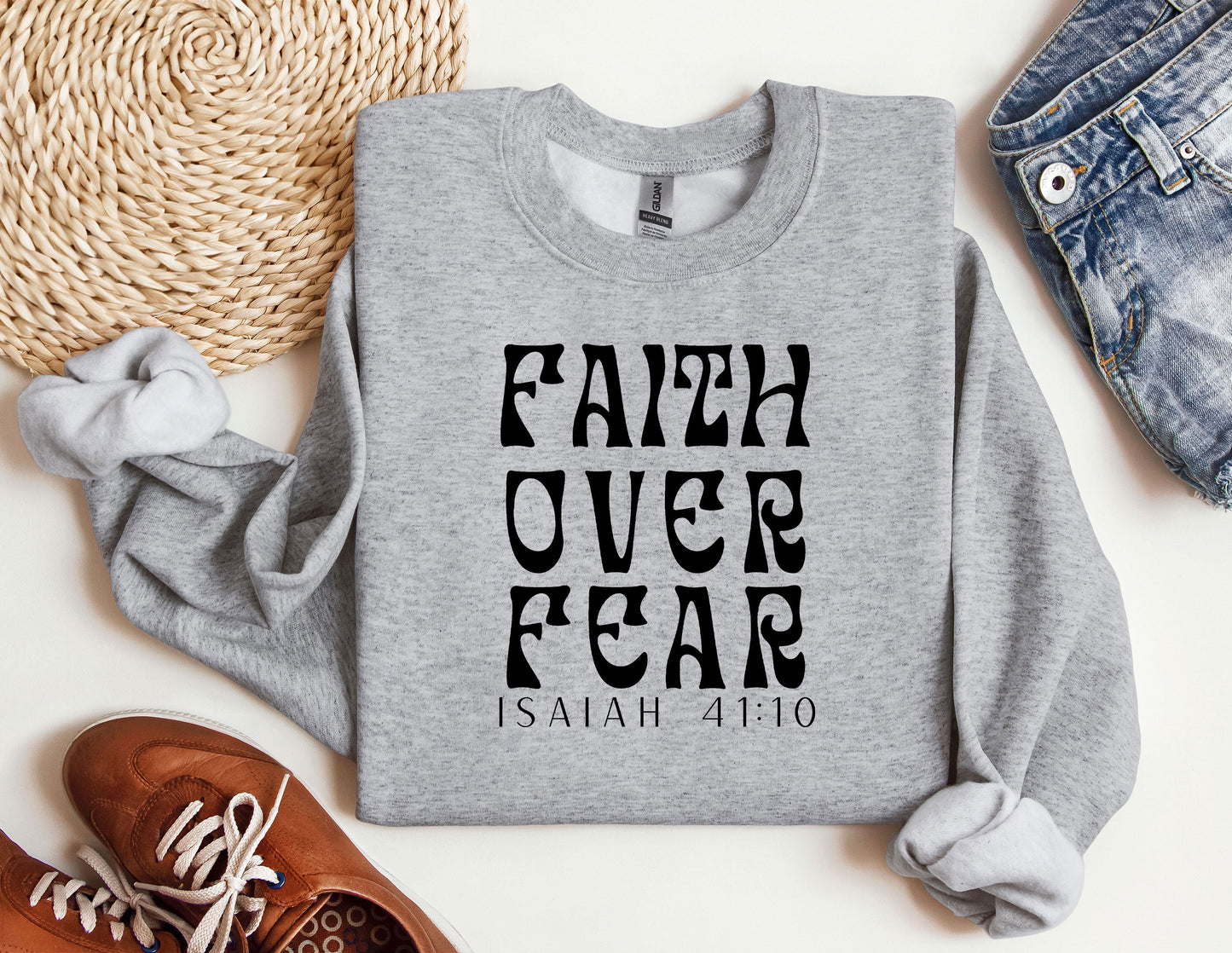 a sweatshirt with the words faith over fear printed on it