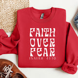 a red sweatshirt with the words faith over fear printed on it