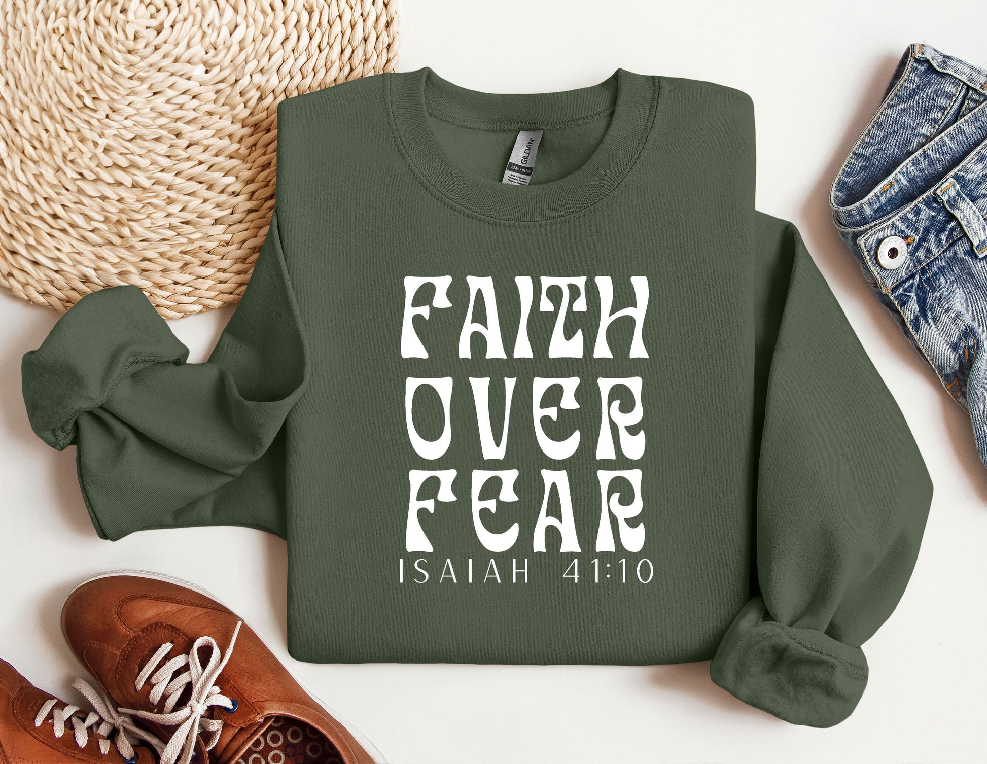 a sweatshirt with the words faith over fear printed on it