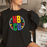 a woman sitting on a bed wearing a black shirt