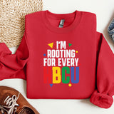 a red shirt that says i'm rooting for every abcu