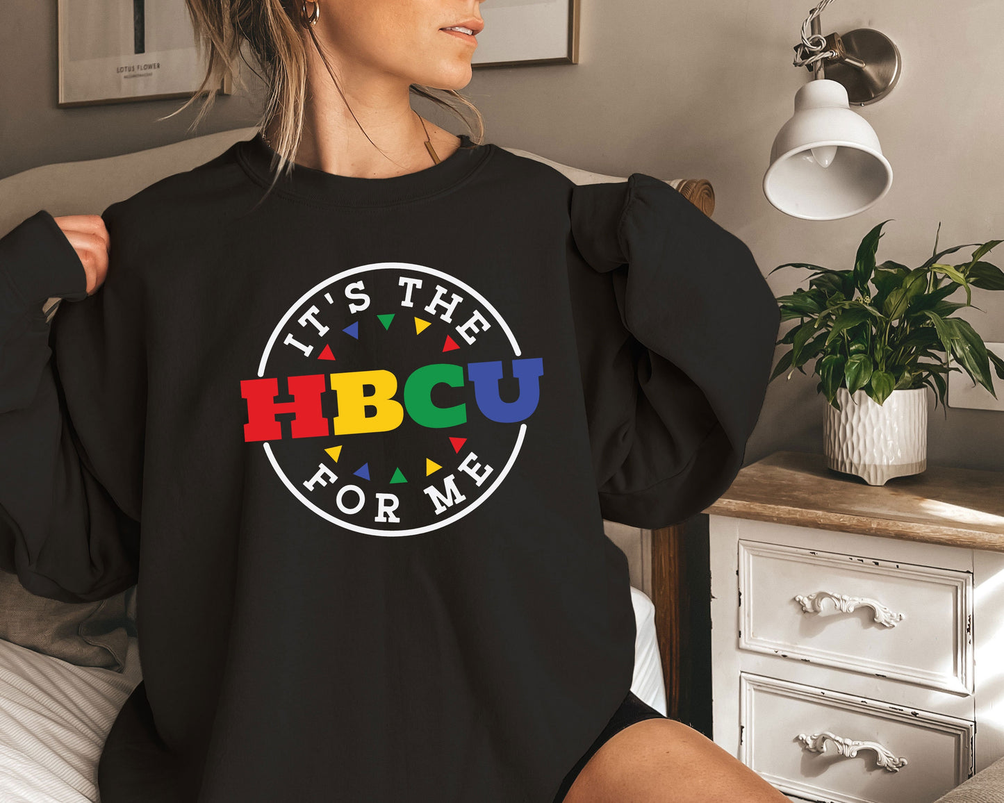 a woman wearing a black shirt that says it&#39;s the hbcu for