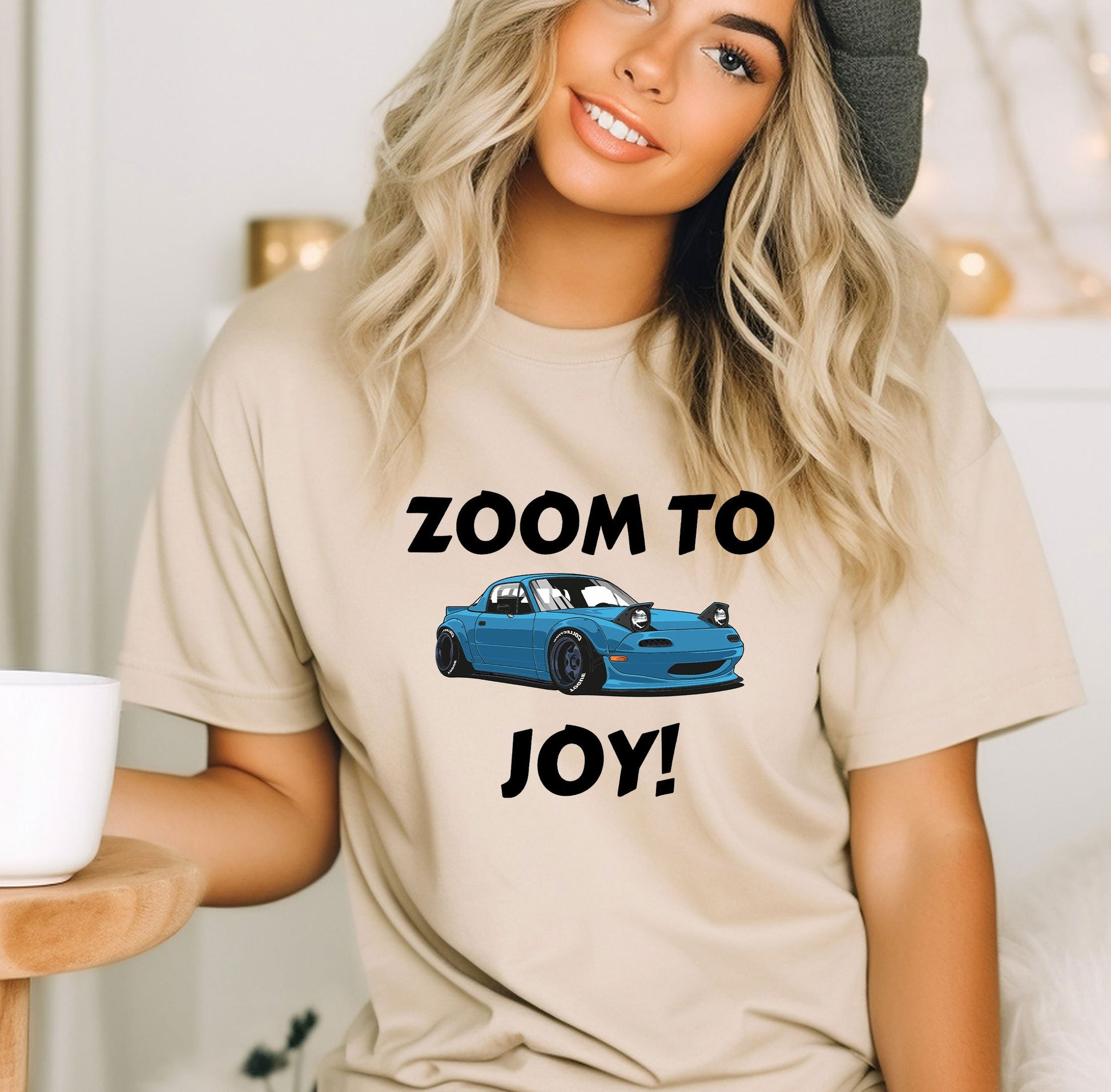 a woman wearing a t - shirt that says zoom to joy