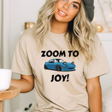 a woman wearing a t - shirt that says zoom to joy