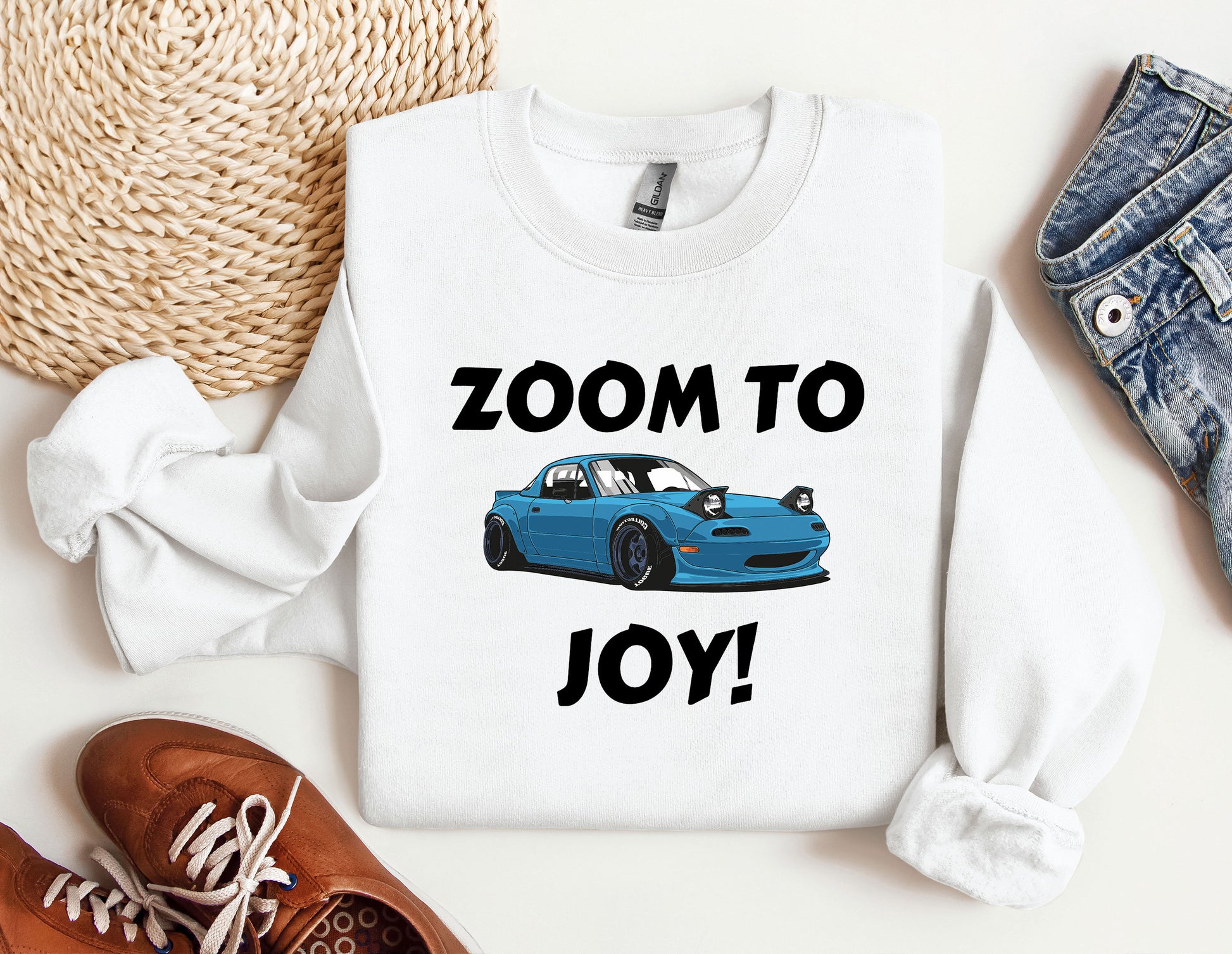 a blue car with the words zoom to joy printed on it