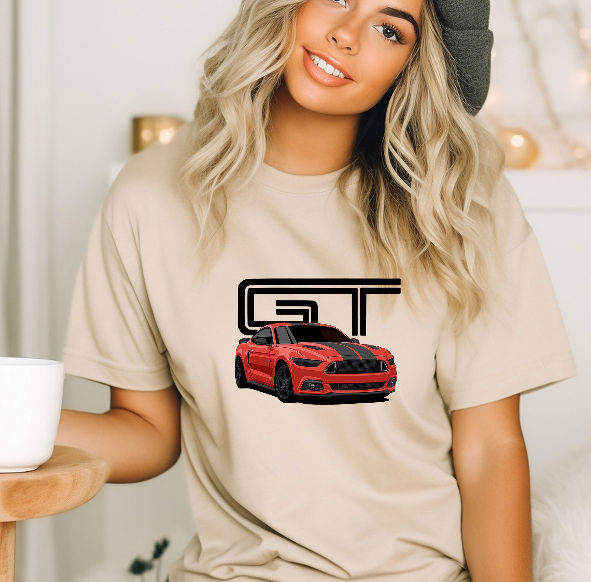 a woman wearing a t - shirt with a red car on it