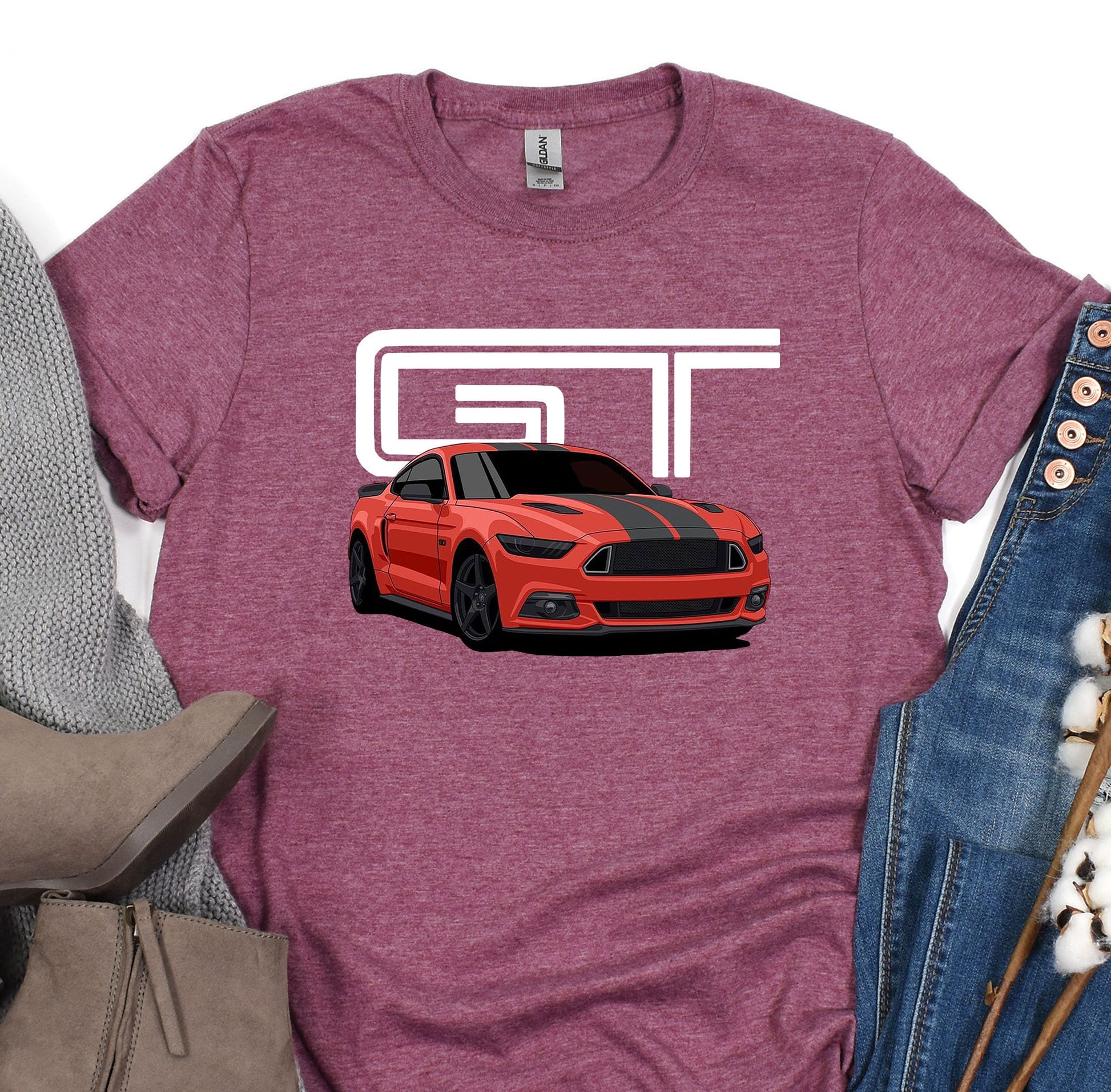 a t - shirt with a red mustang on it