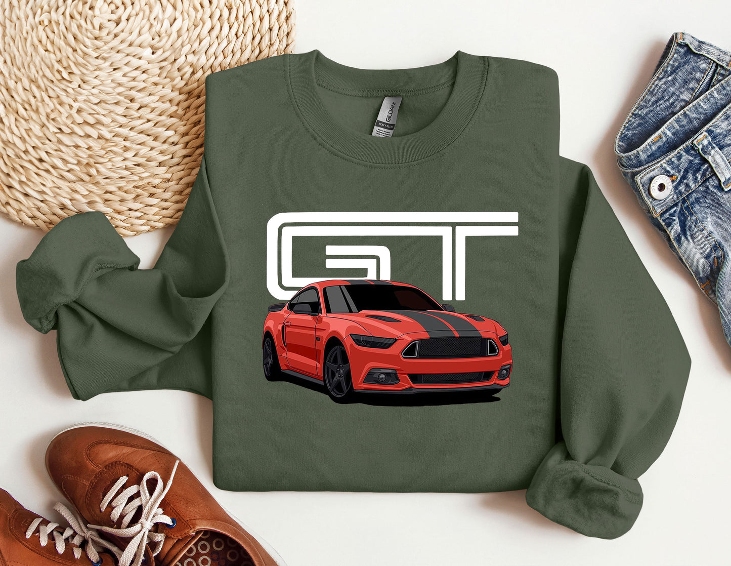 a green t - shirt with a red mustang on it