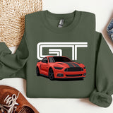 a green t - shirt with a red mustang on it