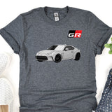 a gray t - shirt with a picture of a car on it