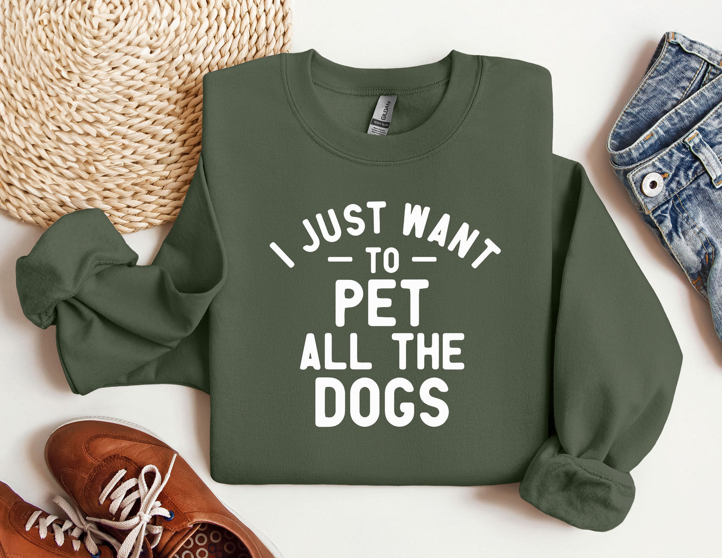 a green sweatshirt that says i just want to pet all the dogs