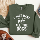a green sweatshirt that says i just want to pet all the dogs