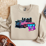 a sweater with a car on it next to a pair of shoes