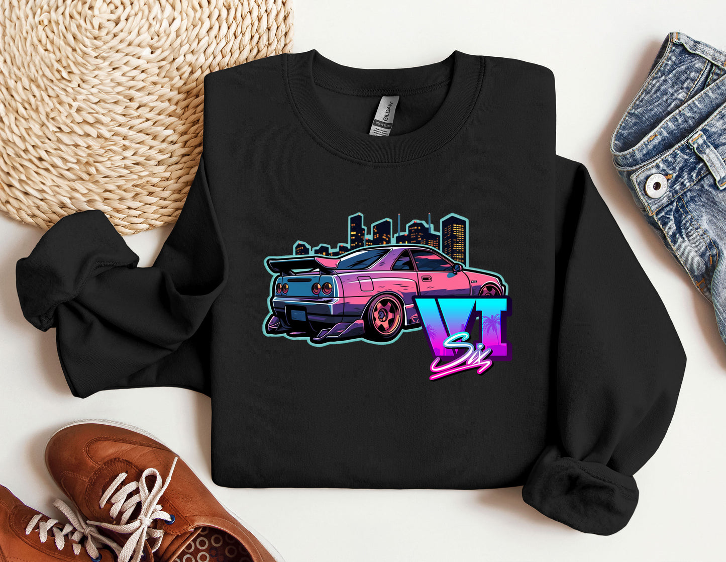 a black shirt with a pink car on it