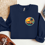 a blue sweatshirt with a picture of a car and palm trees on it
