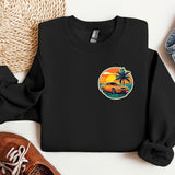a black sweatshirt with a palm tree on it