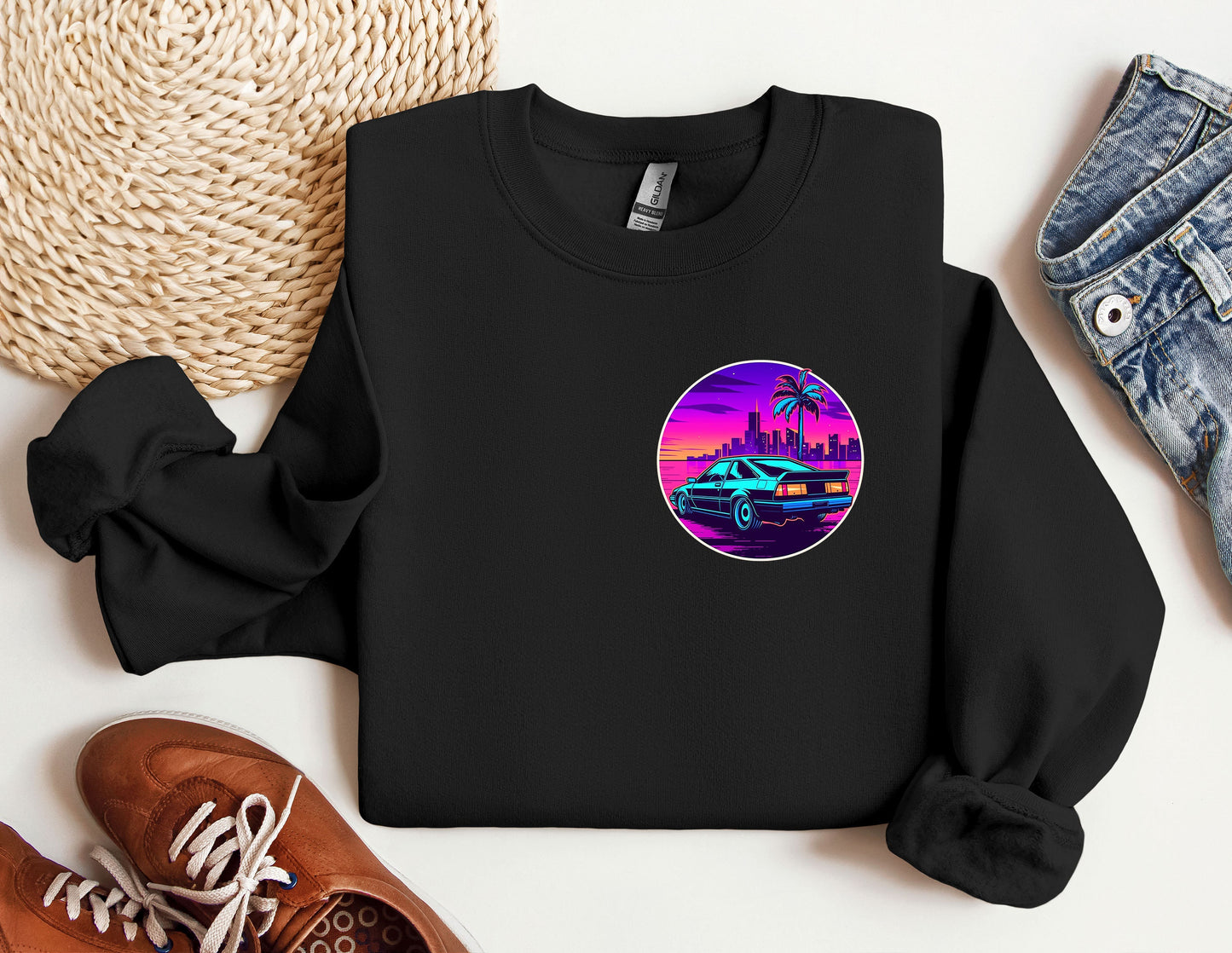 a black sweatshirt with a picture of a car and palm trees