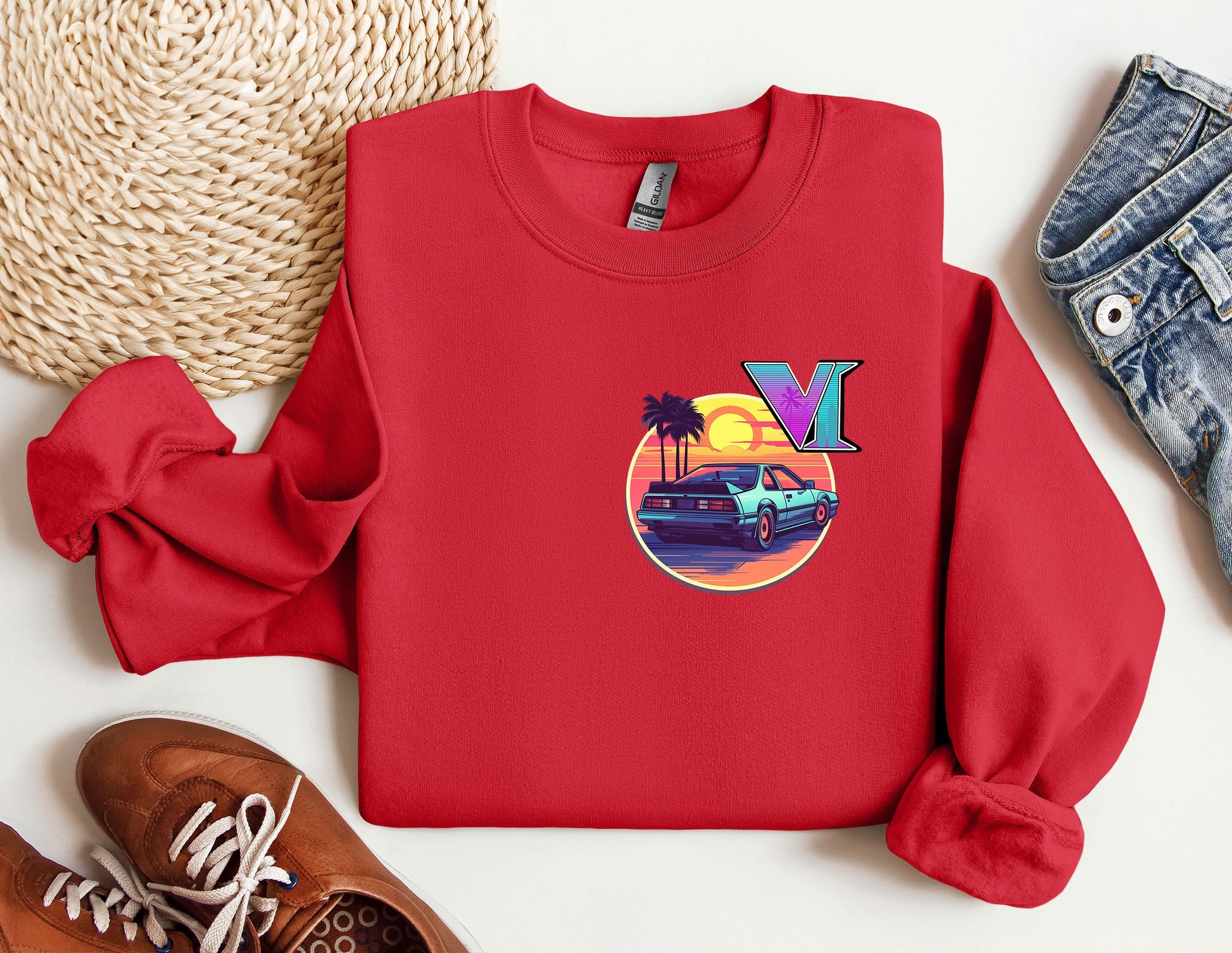 a red sweatshirt with a picture of a vw bus and palm trees