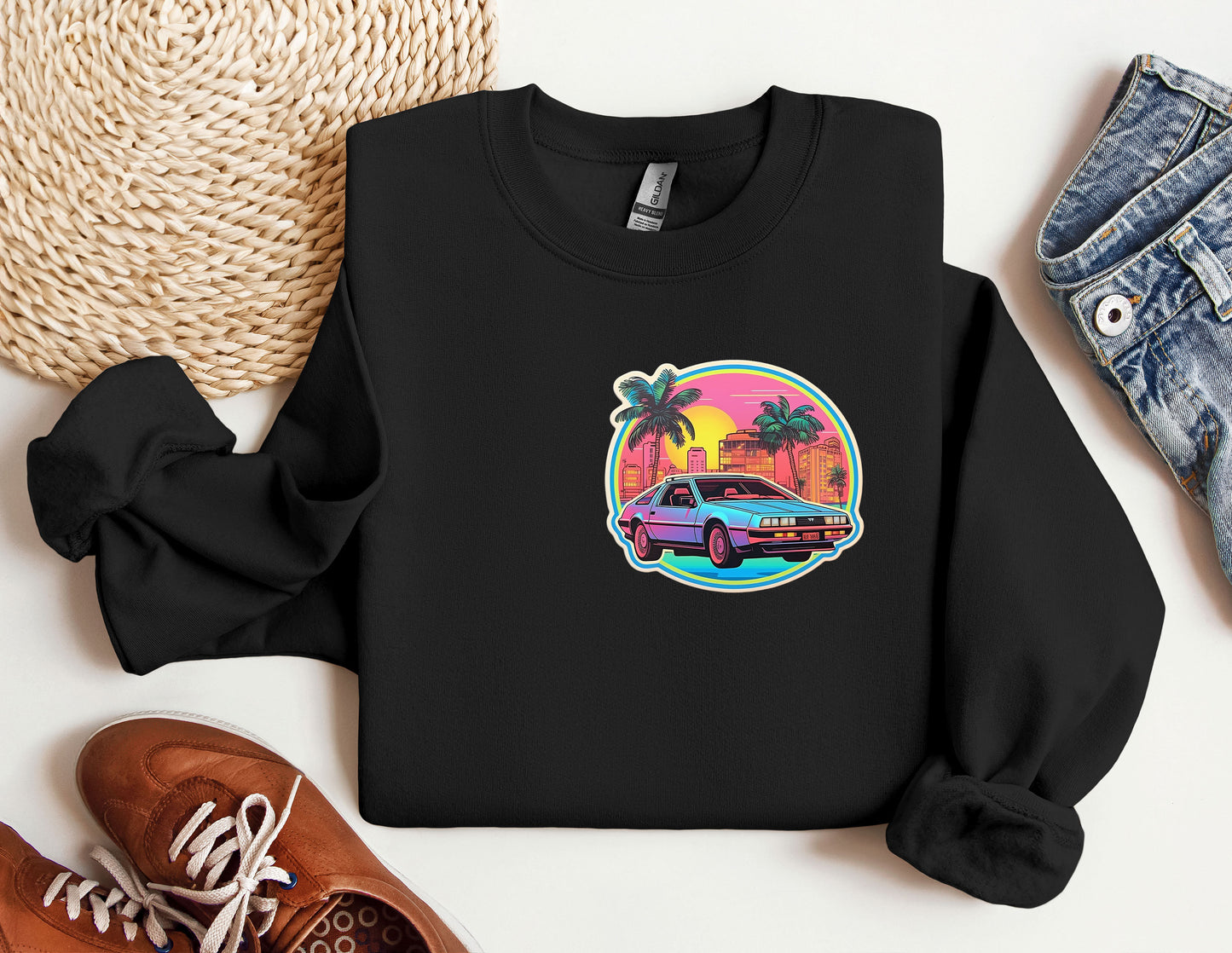 a black sweatshirt with a picture of a car and palm trees