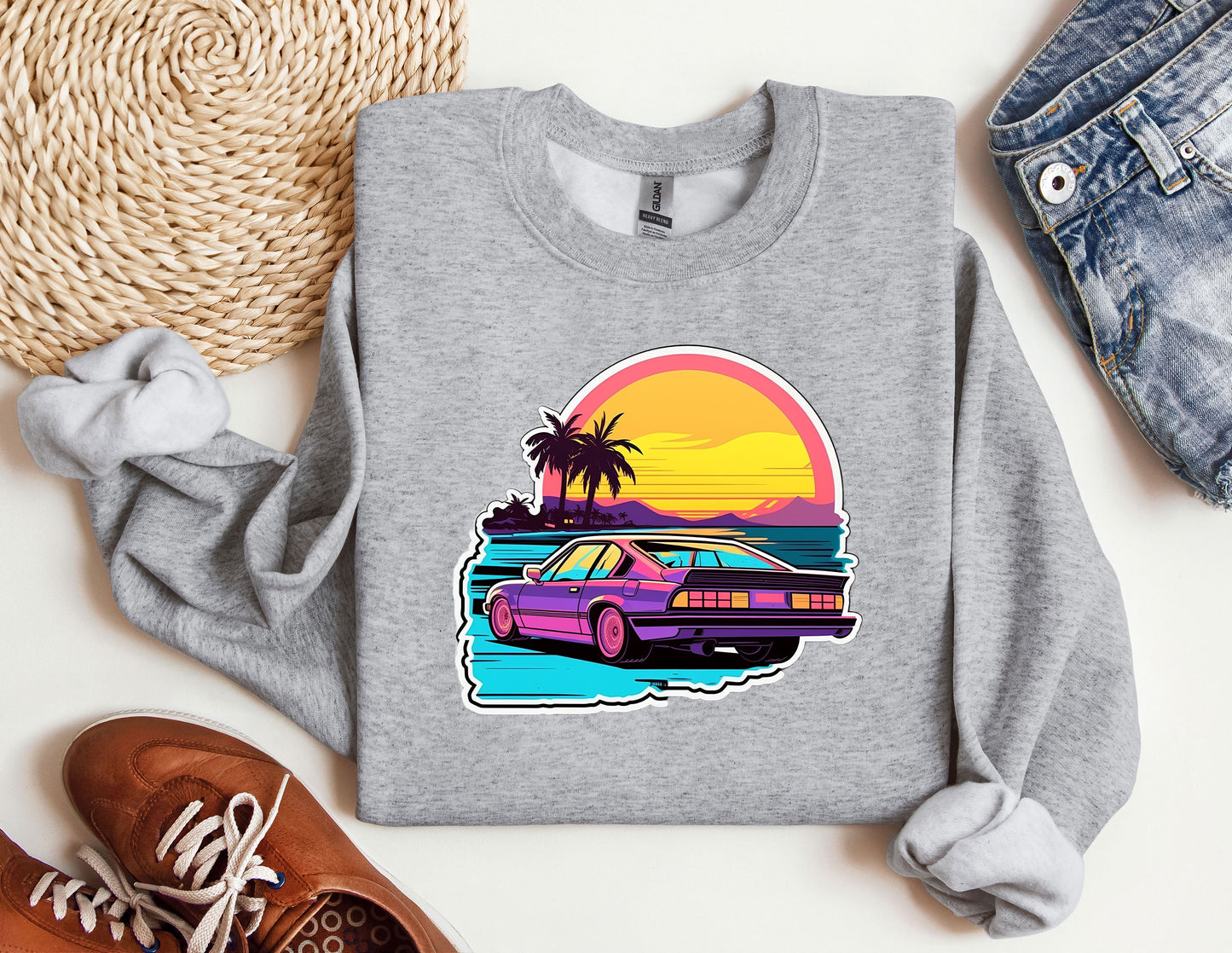 a sweatshirt with a car on the beach and palm trees