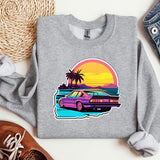 a sweatshirt with a car on the beach and palm trees
