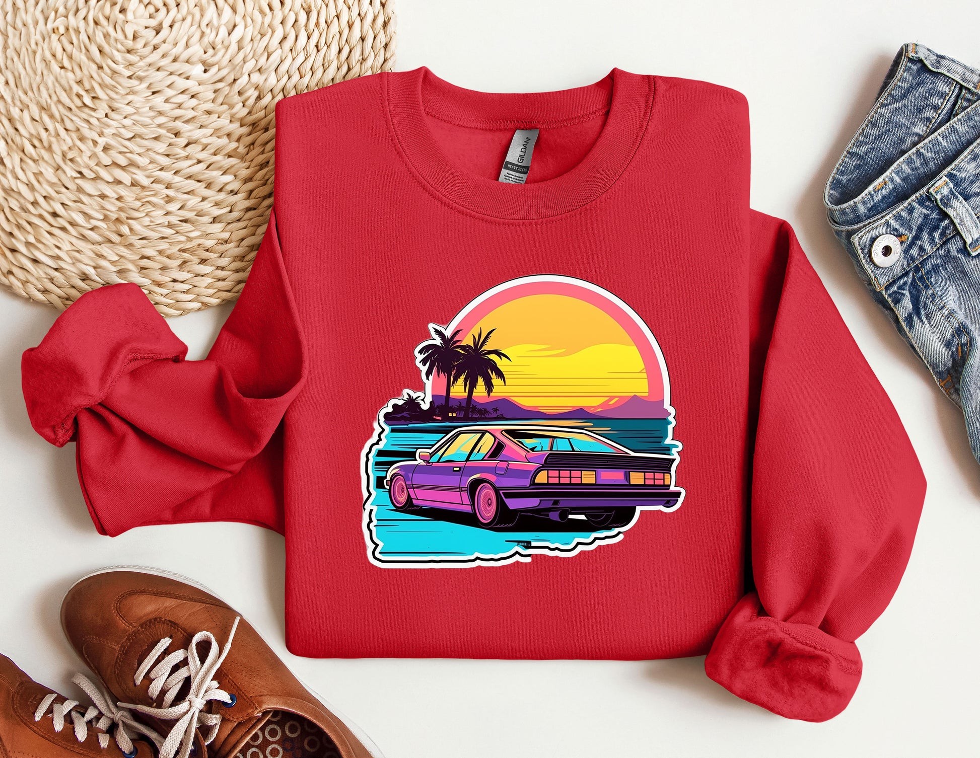 a red sweatshirt with a picture of a car on it