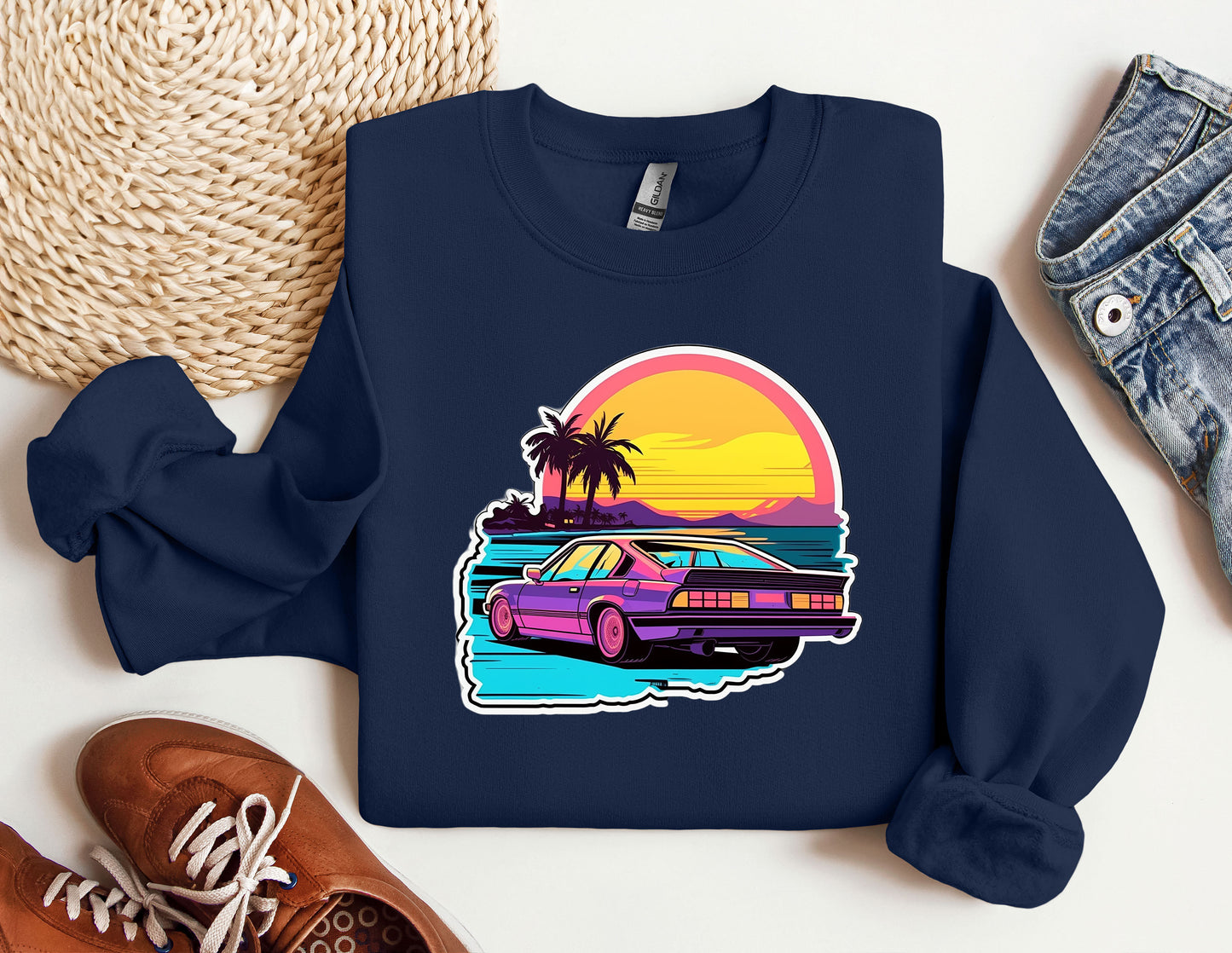 a blue sweatshirt with a purple car on it