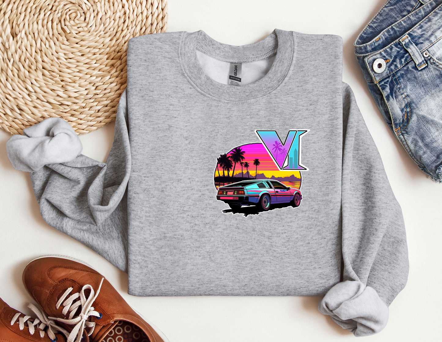 a grey sweatshirt with a picture of a car and palm trees