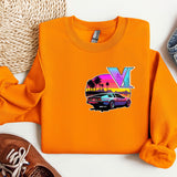 an orange shirt with a v on it next to a pair of shoes