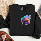 a black sweatshirt with a v on it next to a pair of sneakers