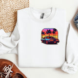 a white shirt with a picture of a car and palm trees