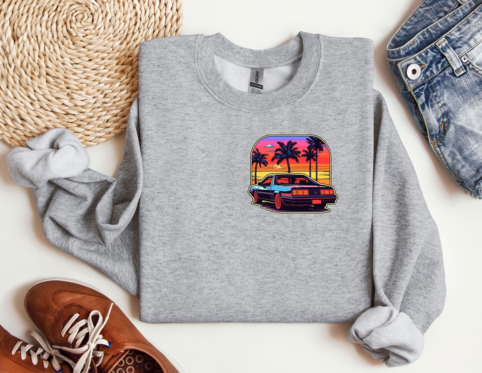 a grey sweatshirt with a picture of a car and palm trees