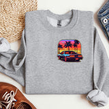 a grey sweatshirt with a picture of a car and palm trees