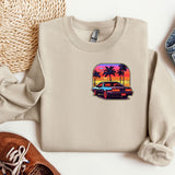 a sweater with a picture of a car and palm trees on it