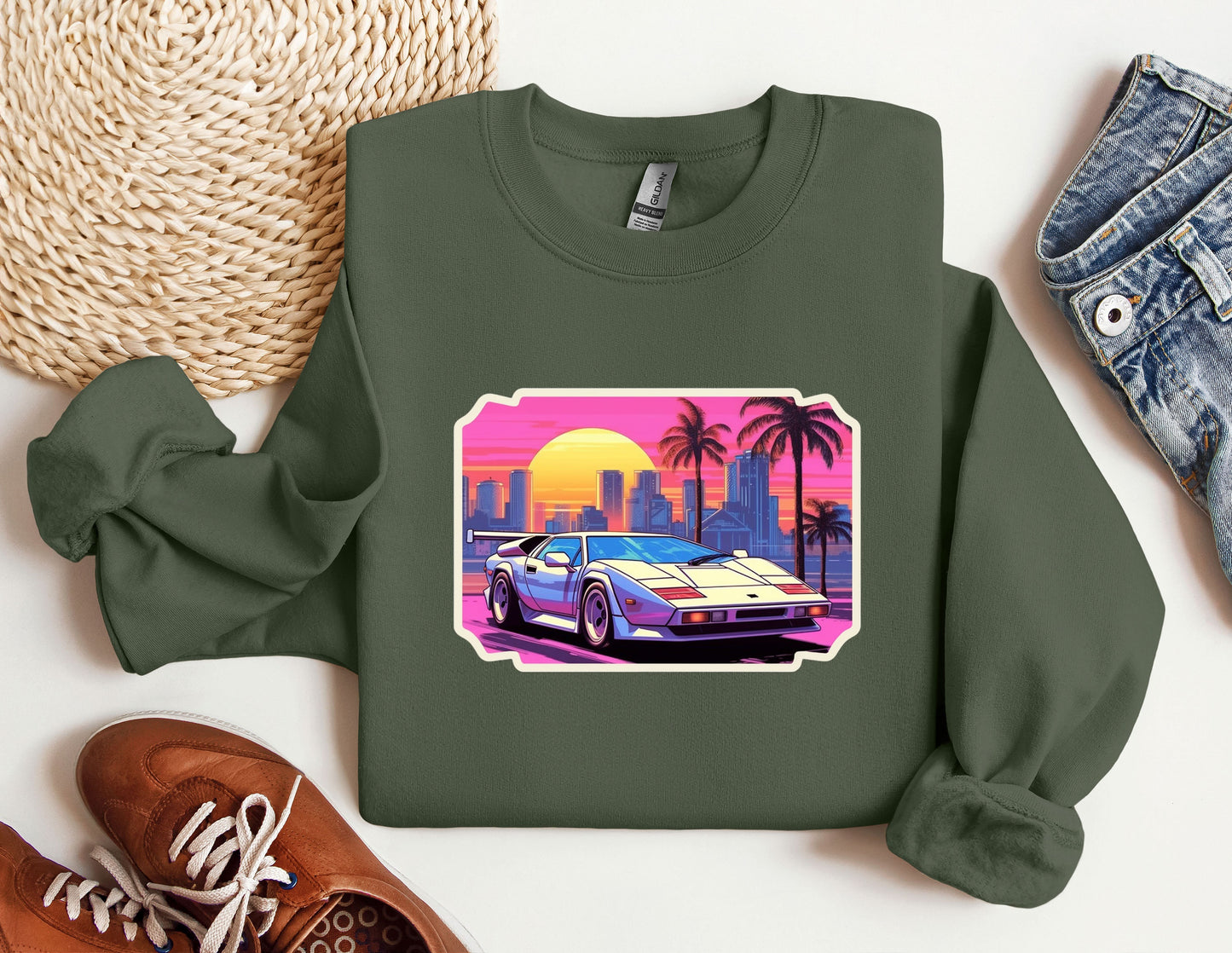 a green sweatshirt with a picture of a car on it