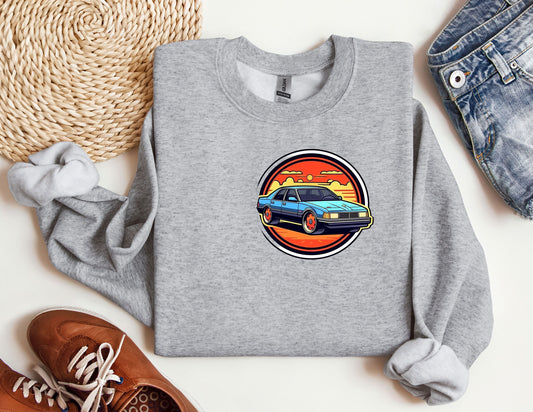 a grey sweatshirt with a blue car on it